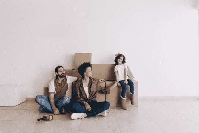 Packers and movers in Maholi navigating narrow streets with furniture and boxes.
