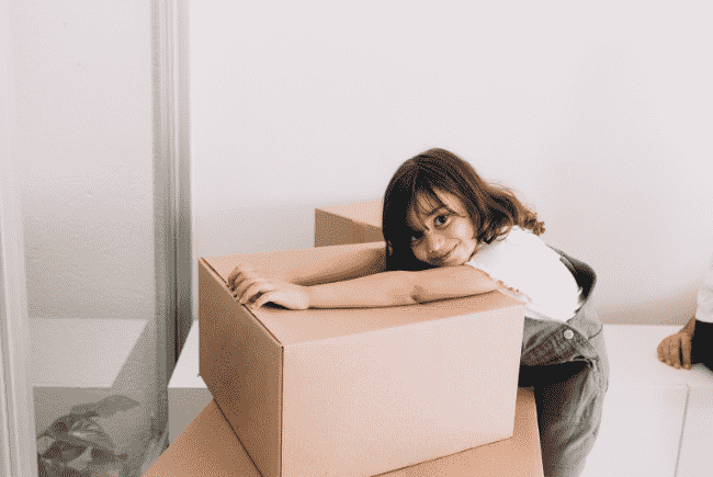 Movers packing office equipment and furniture in Maholi.